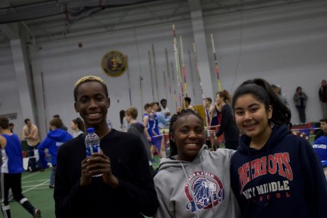 Track athletes Jariq Bevel, Amaria White, and Omyrah Alizai are all smiles between events at the Episcopal meet.