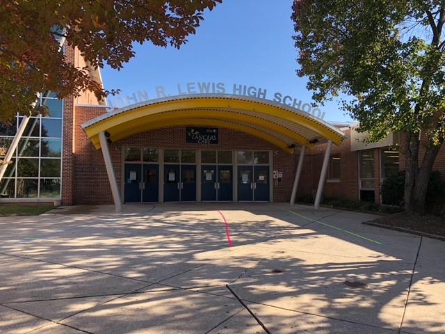 The sign above the main entrance to Lewis High School now reflects the name change.