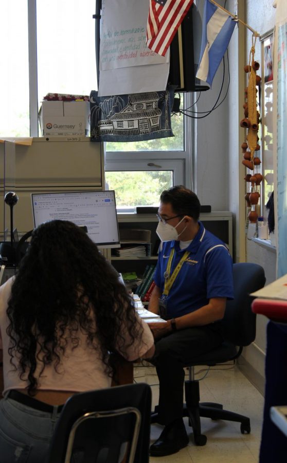 Spanish teacher Erik Giblin tests a student in Spanish for Fluent Speakers.