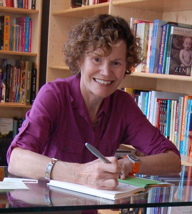In an undated photo, author Judy Blume signs books for fans.