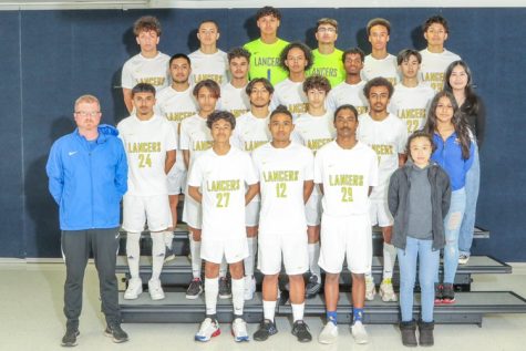 The 2022 Lancer Varsity soccer team, photographed along with head coach John Millward and team managers, launches a successful season.