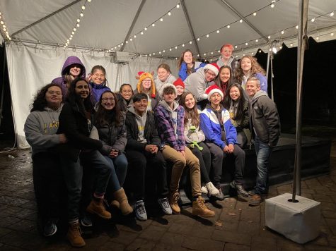 Before COVID closures, writer Bailey Gleason with fellow Lancer Singers and Mr. Hartsell gather at the National Zoos Zoo Lights in December 2019. 