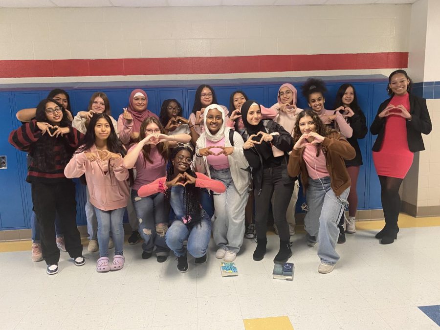 Lewis Girls Need Love club members and sponsor participate in a pink out in October, in honor of Breast Cancer Awareness Month.
