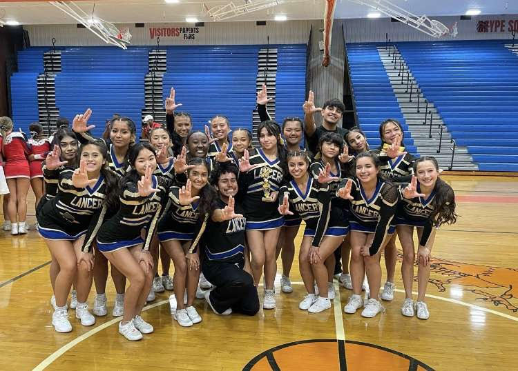 Lewis Varsity Cheer team enjoys a season of accomplishments: placing second and third for invitation competitions and hitting zero at Districts.