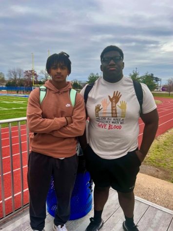 Seniors Besu Desta and Dante Rucker-Agyei, Lewis discus and shot put throwers, challenge one another to achieve personal bests.