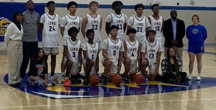 The+greatest+challenge+Lewis+Boys+Basketball+team+%28pictured+with+the+coaching+staff+and+managers%29+faced+this+season+was+growing+a+winning+mindset.