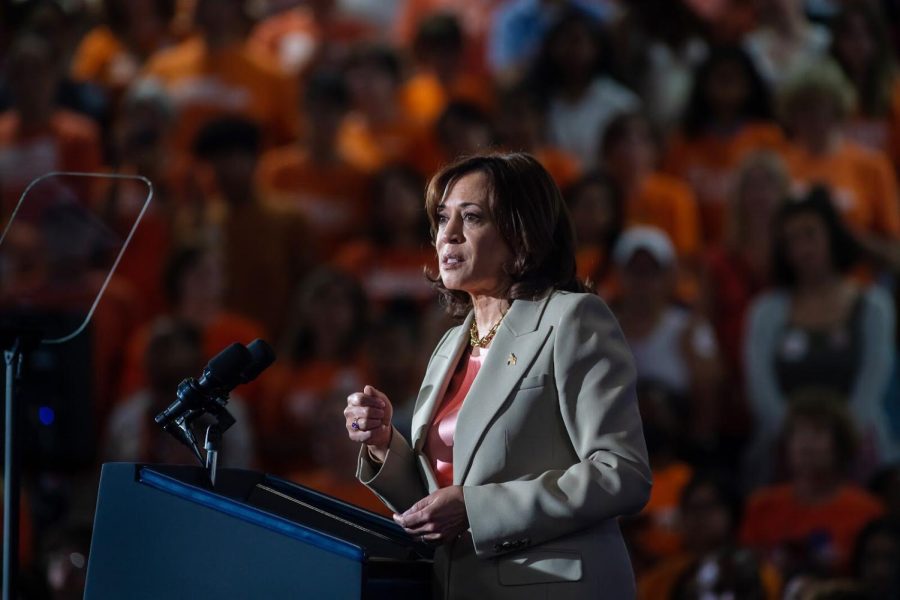 Vice President Kamala Harris addresses a crowd of orange made of Lewis students and staff, community members, and advocates on Friday, June 2 at Lewis High School's Main Gym.