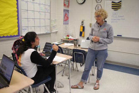 IB Anthro/Law In Action teacher Holly Miller catches up with senior Nabeeha Mahmood during advisory.