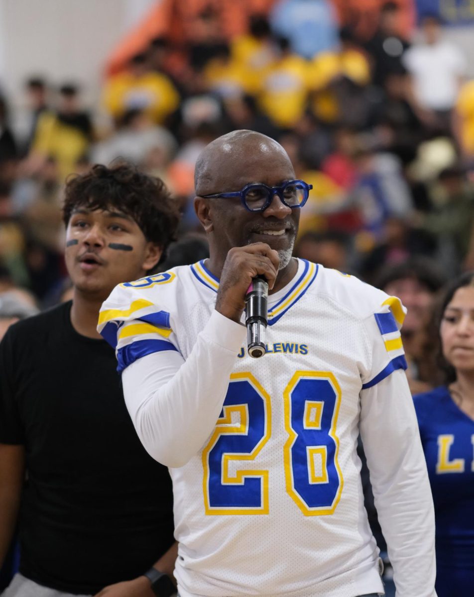 Principal Alfonso Smith raises student spirit at his last Lewis pep rally held before Homecoming, Oct. 17.