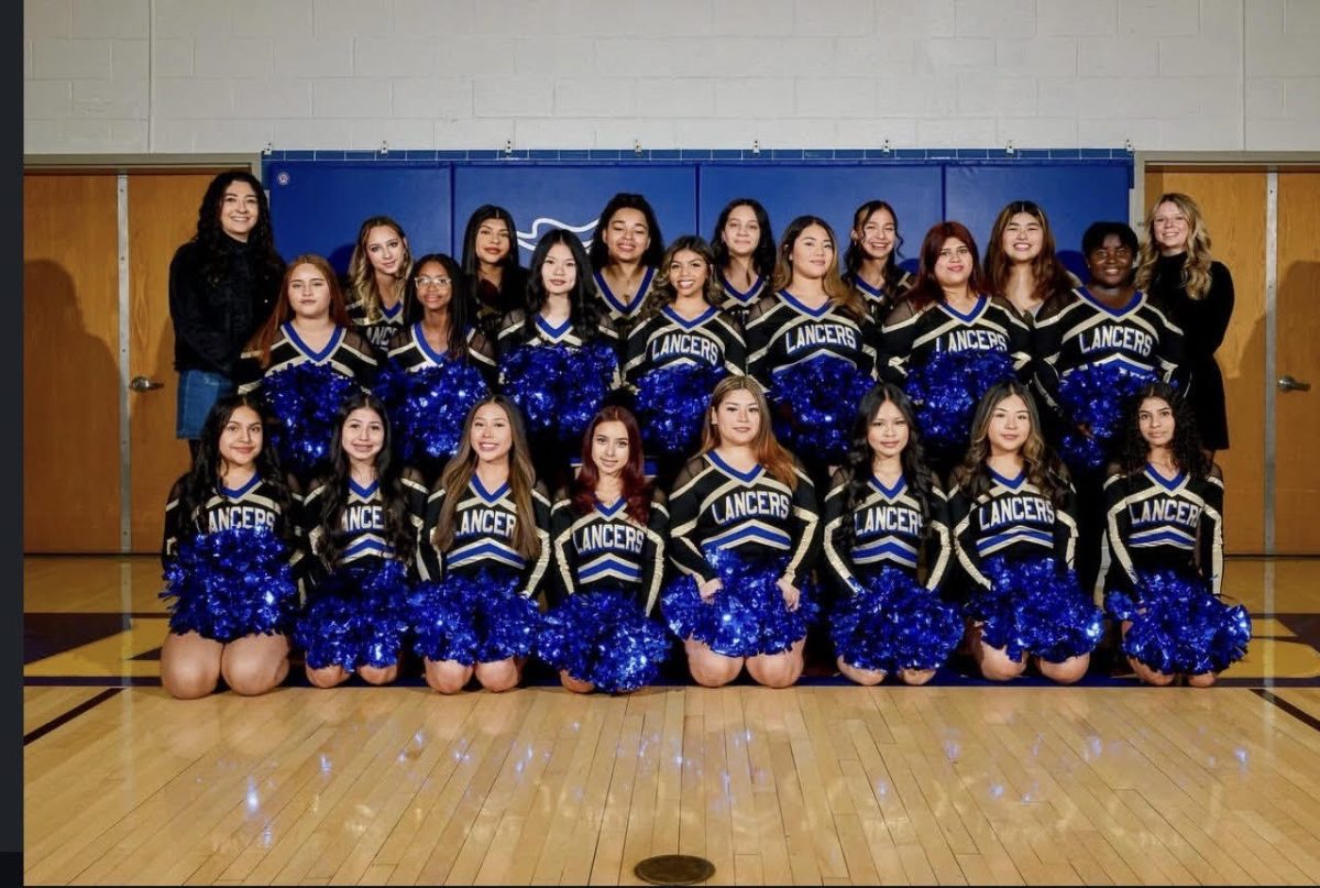 Proud members of Lewis' Winter Cheer Team celebrate their third season with Coaches Amber Ucekay and Katie Anderson.