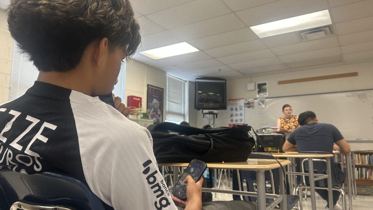A Lewis student demonstrates how to sneak classroom cell phone use, banned by FCPS' current policies, without attracting notice.
