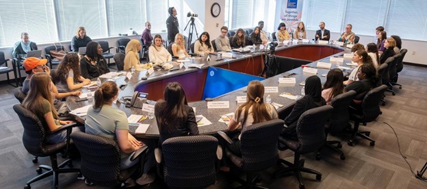 FCPS high school student journalists gather at Gatehouse Administration Center to discuss the role of A.I. in education.